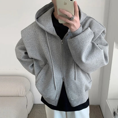 Model wearing the gray Oversized Hooded Front-Open Sweatshirt