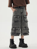 A model wearing the black Heavy-duty Multi-pocket Cargo Jorts in a gray background 