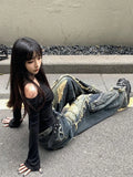 Model wearing the blue Grunge Distressed Denim Jeans