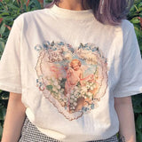 Model wearing the white Cherub Heart With Love And Devotion T-Shirt
