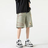 Stylish Spliced Button Zipper Ripped Shorts