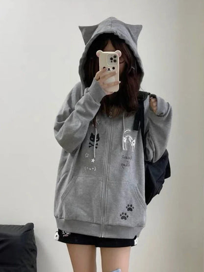 Model wearing the gray Y2K Kitty Paw Print Sweatshirt