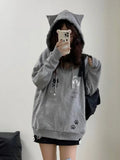 Model wearing the gray Y2K Kitty Paw Print Sweatshirt