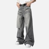 Model wearing the gray Vintage Distressed Baggy Jeans