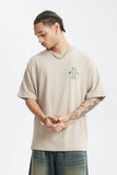 Model wearing the khaki Character Platform T-Shirt 