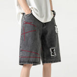 Stylish Spliced Button Zipper Ripped Shorts