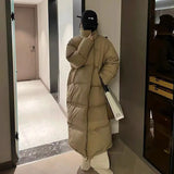 Model wearing the khaki Women's Long Down Puffer Jacket