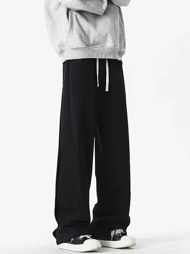 Front view of the black Loose Fit Pleated Sweatpants