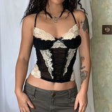 Model wearing the black Lace-Trimmed Ruched Bustier Top