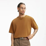 Model wearing the orange Essential Everyday T-Shirt