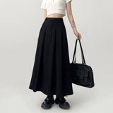 Model wearing the black Long Pleated Skirt