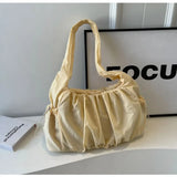 Front view of the yellow Wanderlust Sling Bag  