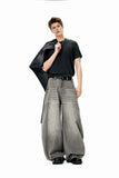 Model wearing the light grey Vintage Wid-Leg Denim Jeans in a gray background