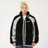 A model wearing the black Corduroy Patchwork Padded Retro Puffer Jacket from DAXUEN