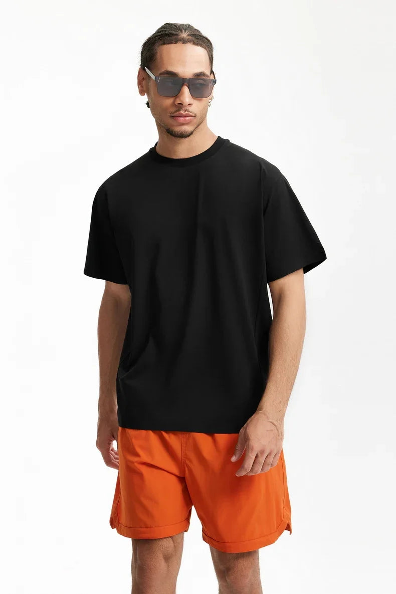 Model wearing the black Y2K Essential T-Shirt