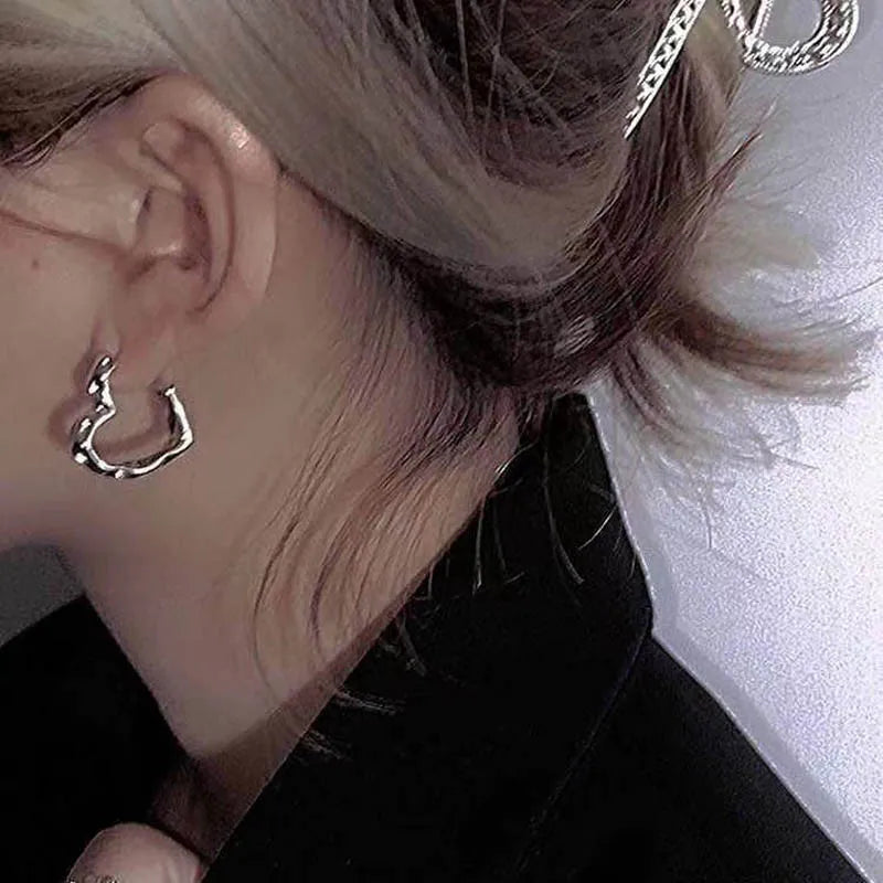 Model wearing the Waveform Elegance Earrings