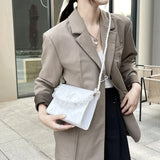 Model wearing the white Coquette Pearl Chain Shoulder Bag