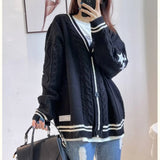 Model wearing the black Vintage Cable-Knit Sweater