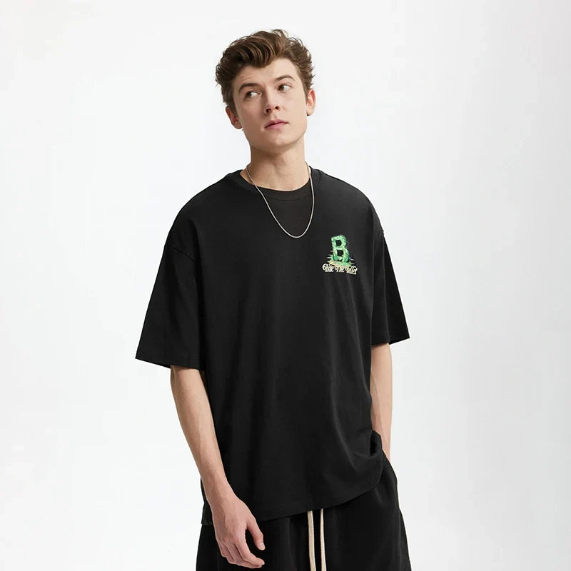 Model wearing the black Grizzly B Graphic T-Shirt