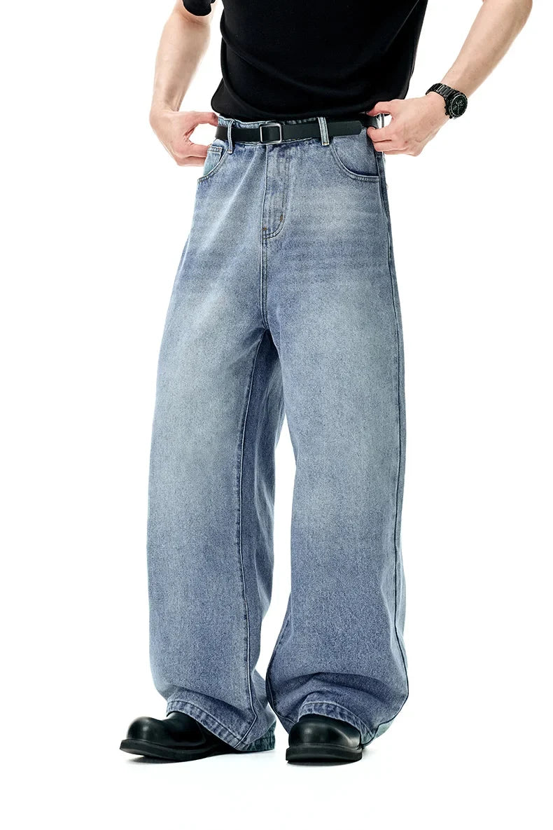 Model wearing the light blue Retro Freedom Fit Jeans in a gray background