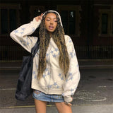 A model wearing the white Vintage Star Graphic Hoodies