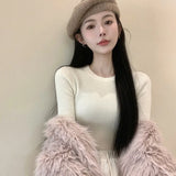 Model wearing the white Long-Sleeve Ribbed Crop Sweater