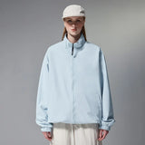 Model wearing the blue Minimalist Zip-Up Jacket 