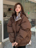 Model wearing the coffee Oversized Women's Puffer Jacket