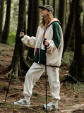 A girl in the forest wearing apricot color block jacket