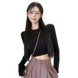 Model wearing the black Long-Sleeve Ribbed Crop Sweater