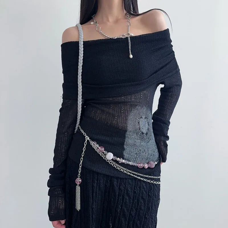 Model wearing the black Off-Shoulder Graphic Print Top