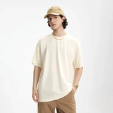 Model wearing the apricot Essential Everyday T-Shirt
