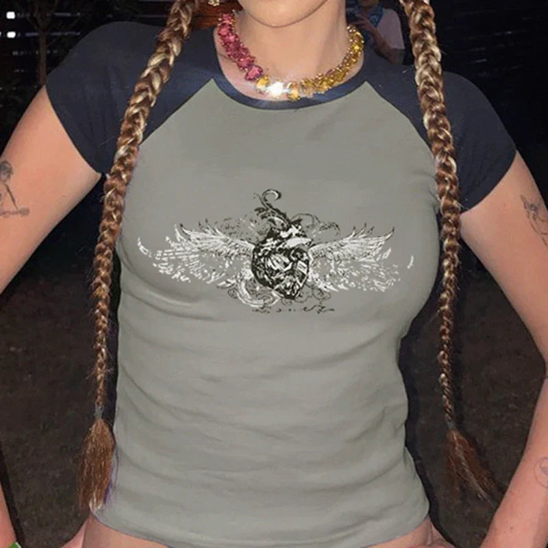 Model wearing the gray Winged Skull Emblem Graphic T-shirt 