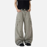 Person wearing beige cargo pants on a white background