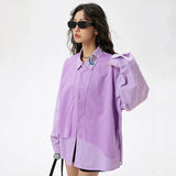 A model wearing the Women's Purple Rose T-shirt from DAXUEN.