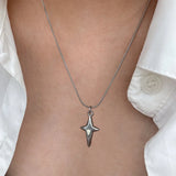 Model wearing the Star Cross Pendant Necklace