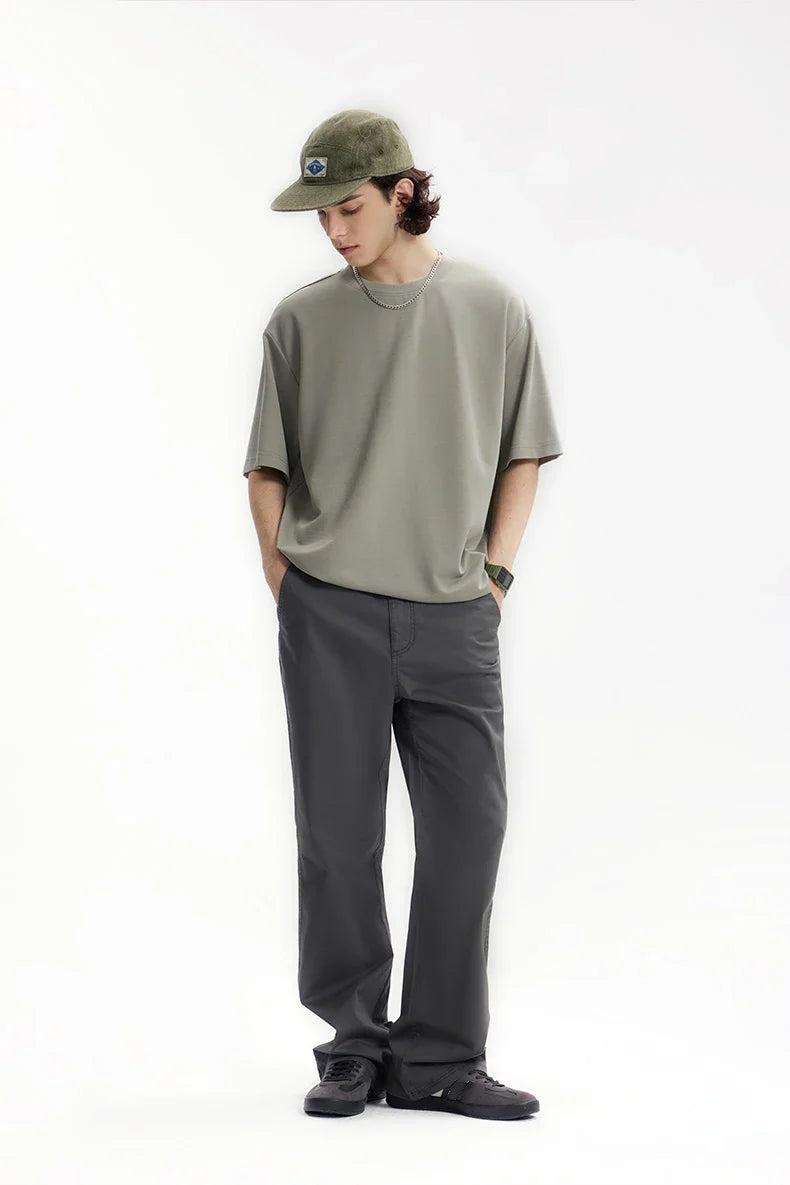 Model wearing the dark gray Men's Straight-Leg Chino Pants