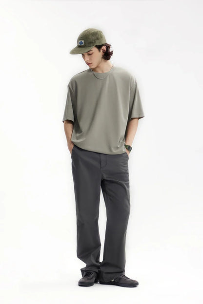 Model wearing the dark gray Men's Straight-Leg Chino Pants