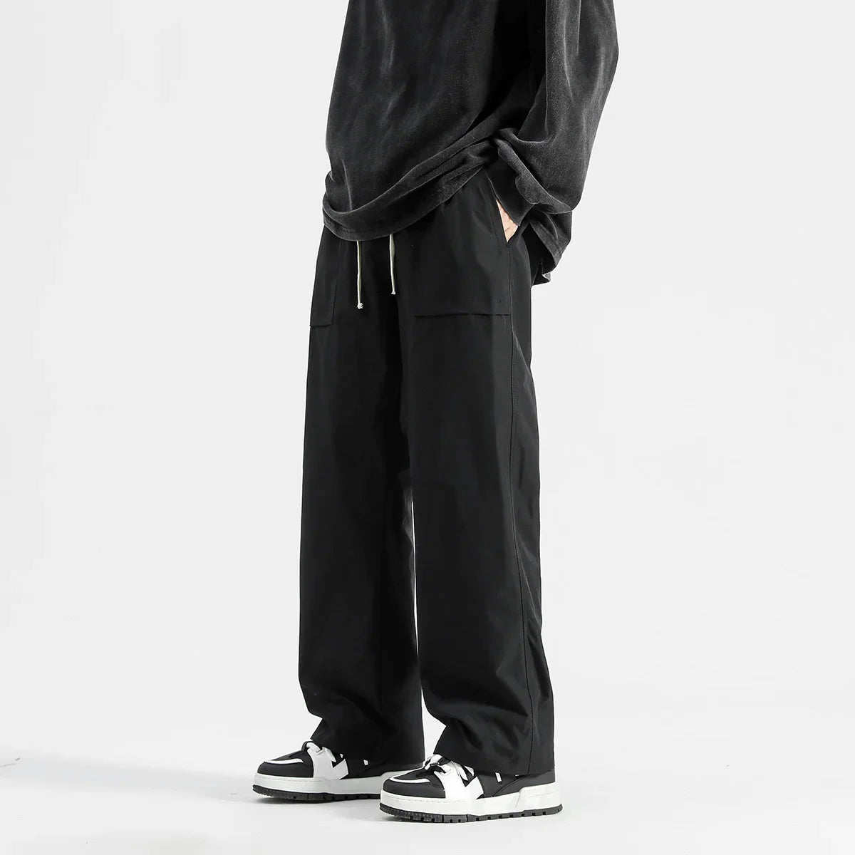 Model wearing the black Wide-Leg Drawstring Cargo Pants