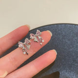 Front view of the pink Gleaming Charm Drops Earrings
