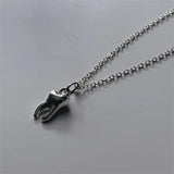 Front view of the Tooth Pendant Necklace 