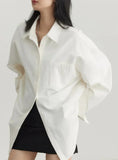 Model wearing the white Relaxed Fit Button-Up Shirt