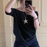 Model wearing the black Relaxed Off-Shoulder T-Shirt 
