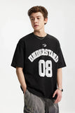 Model wearing the black Understand 08 T-Shirt