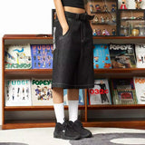 Model wearing the black Oversized Cargo Jorts