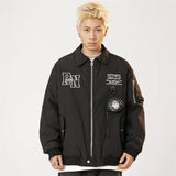 Model wearing the black Vintage 1968 Utility Jacket in a gray background