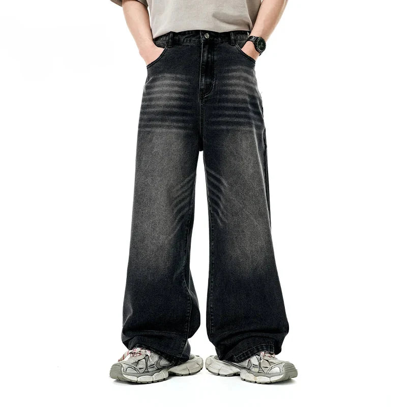 Model wearing the black Retro Freedom Fit Jeans in a gray background