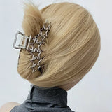 Model wearing the star Y2K Orbit Hair Claw