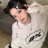 Model wearing the white interstellar Knit Reverie Sweater