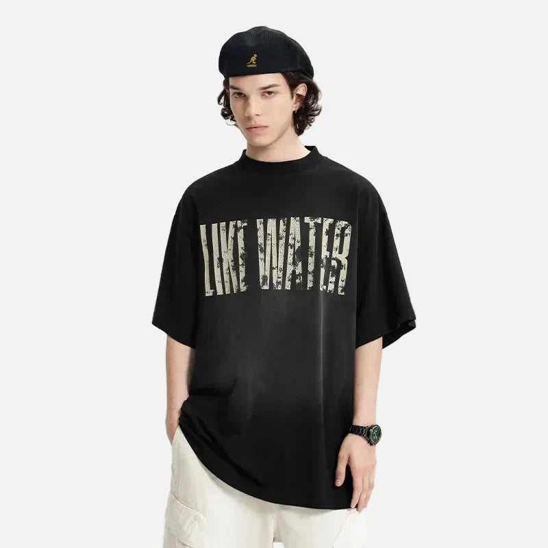Model wearing the black LIKE WATER T-Shirt